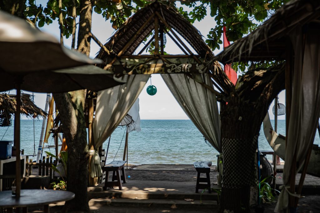A scenic tropical cafe setup in Seminyak Bali representing safe travel environments.