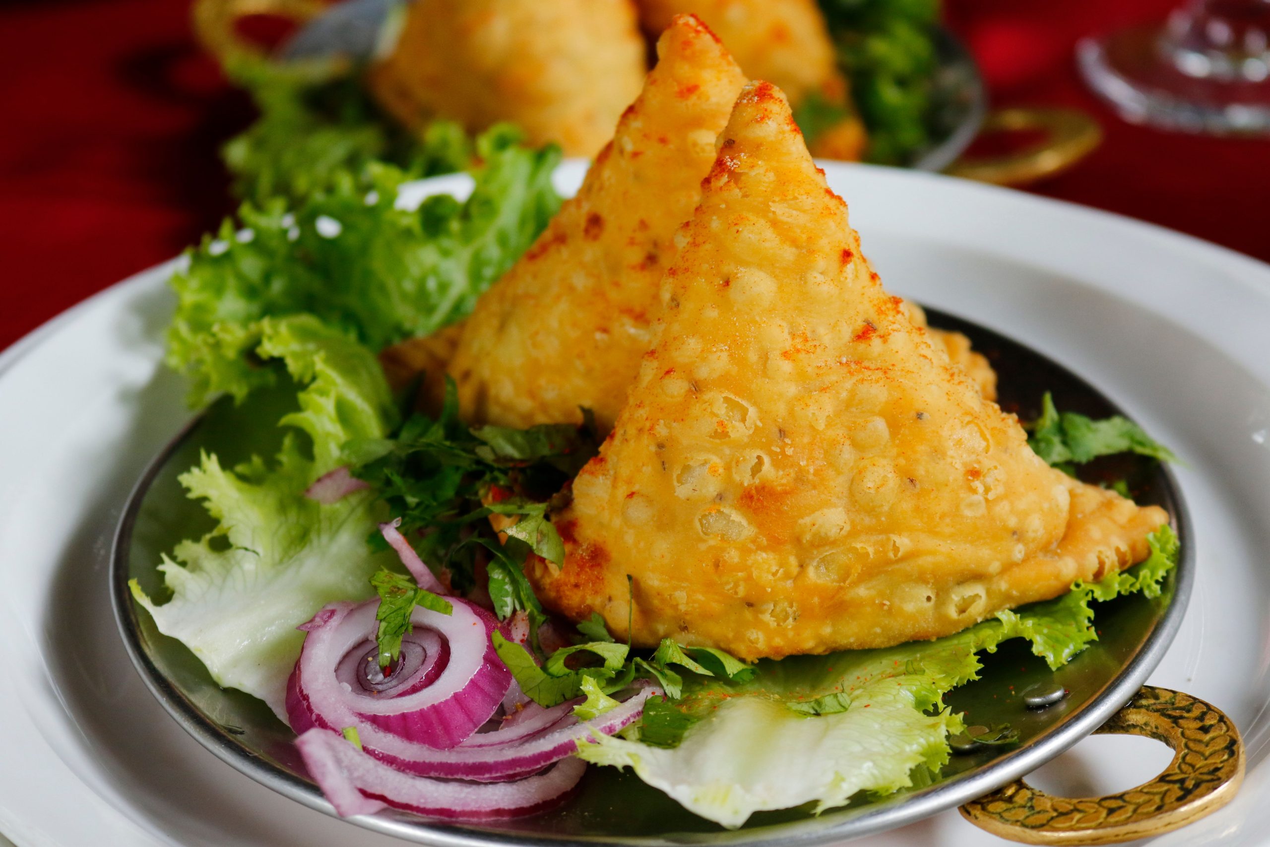Sticking to high-heat, deep-fried snacks like fresh samosas is your best defense against bacteria.