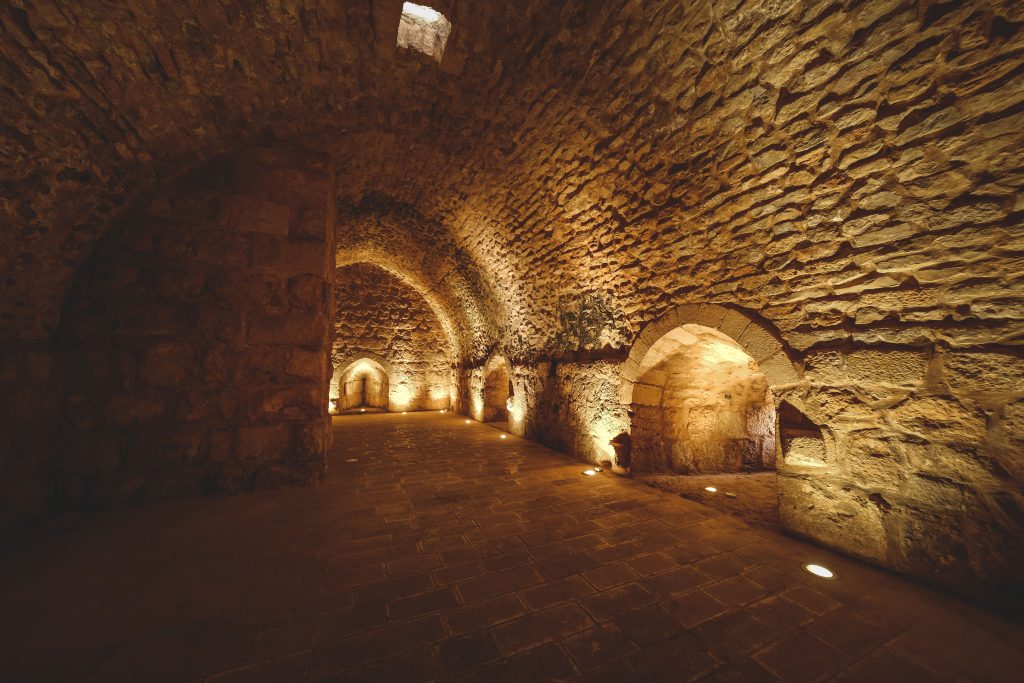 Ancient stone crypt interior representing a secret free museum in London.