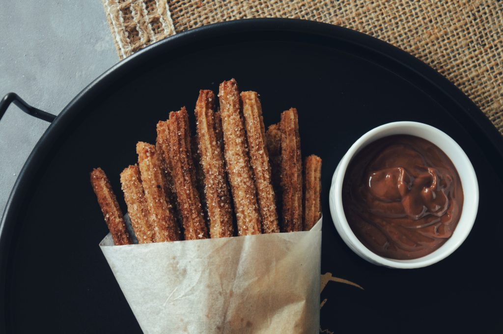 Macro close up of freshly fried churros with zero hands or people