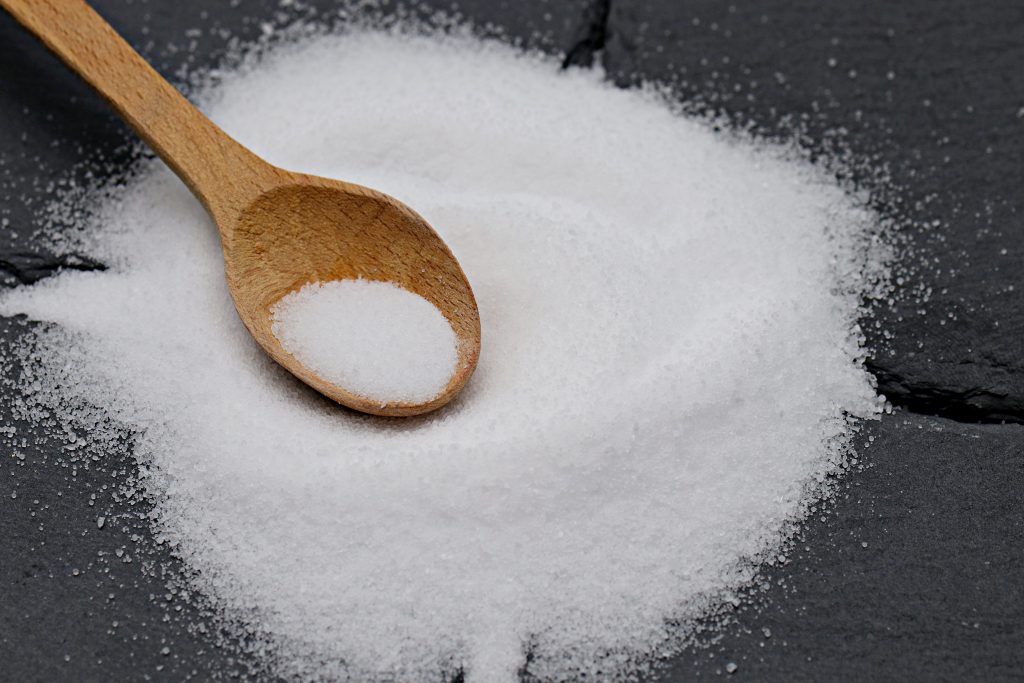 Bowl of white Monosodium Glutamate MSG seasoning powder for Thai cooking