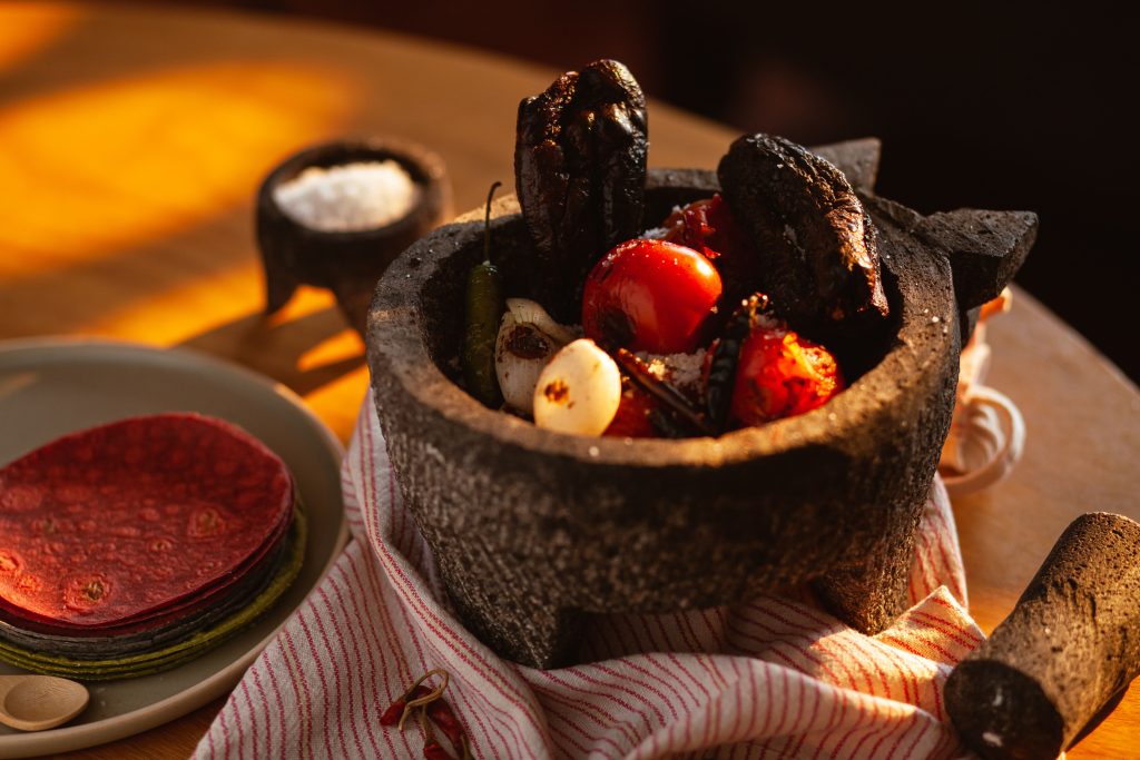Best beginner mexican cookbooks ingredients and spices on a wooden table