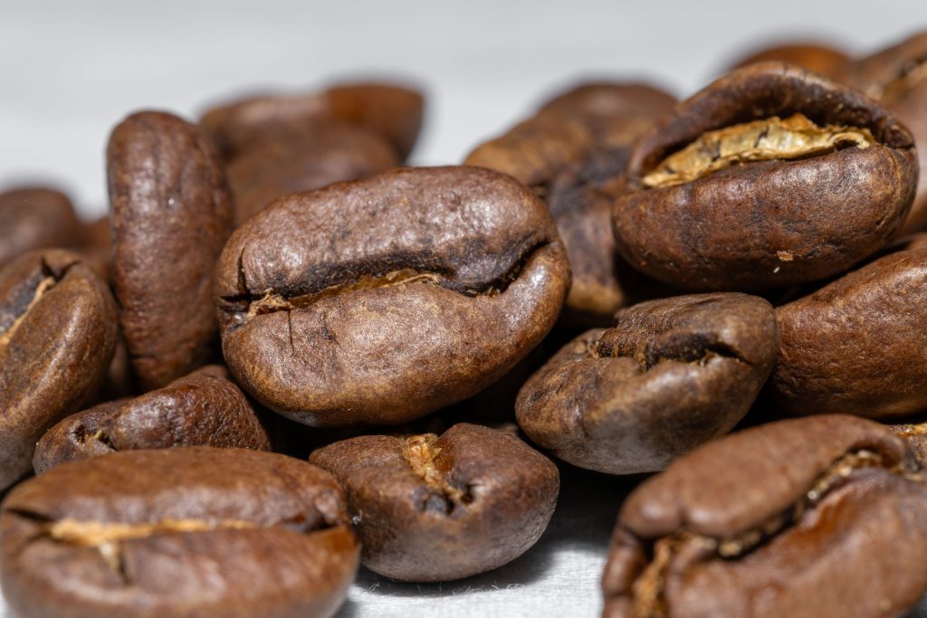Macro shot of freshly roasted commercial coffee beans potentially containing trace solvent residues